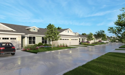 The exterior of our active adult community in Port St Lucie, featuring a view of the apartments with garages and lawns.